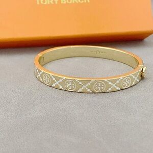 Tory Burch Gold and Cream Patterned Enamel Logo Bangle